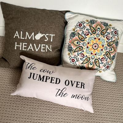 Lot 142 3 decorative pillows - almost heaven, the cow jumped over the moon, floral
