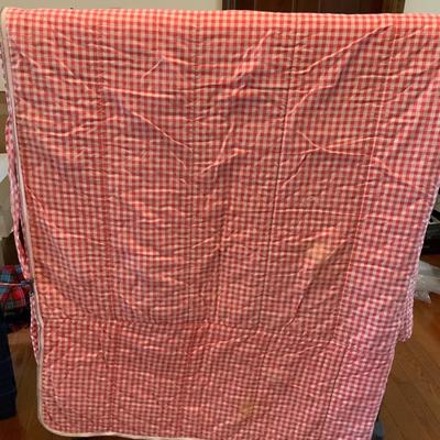 Red and white checkered vintage sleeping bag.