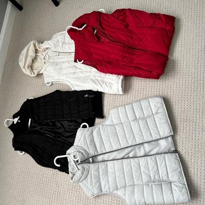 Lot 146 4 Women's vests -black, grey, white, red (2 L and 2 XL)