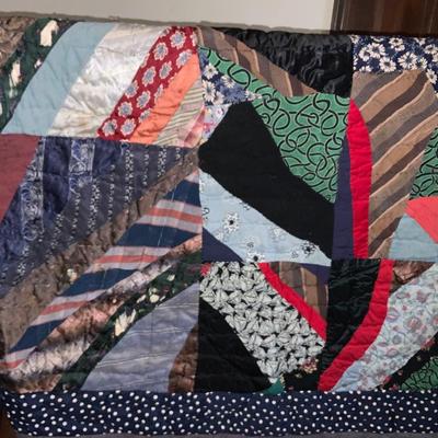 Vintage quilt approximately 52” x 84”.