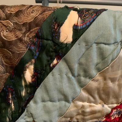Vintage quilt approximately 52” x 84”.