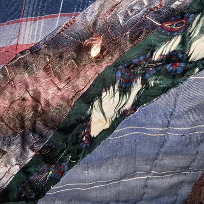 Vintage quilt approximately 52” x 84”.
