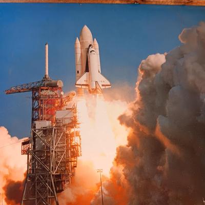 WALL MIRROR, PHOTO OF A SPACE SHUTTLE AND A TALL NARROW CORK BOARD