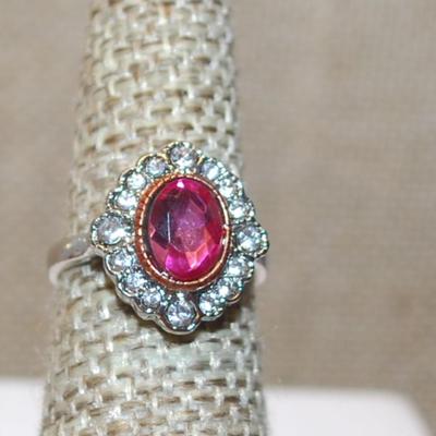 Size 5 Oval Translucent Red Stone Ring with Full Surround on a Silver Tone Band (3.4g)