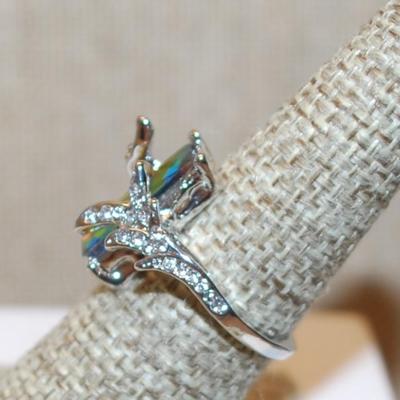 Size 7 Long Iridescent Rectangle Stone Party Ring with Fancy Wrap-Around Setting on a Silver Tone Band (4.4g)