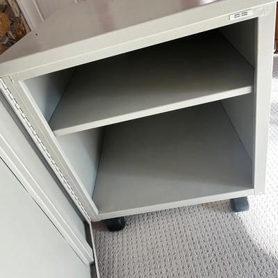 Lot 174 metal storage cabinet on casters