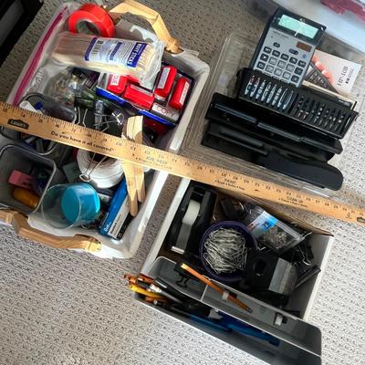Lot 183 Rubbermaid tote of office supplies and stamps, binder clips, multiple calculators