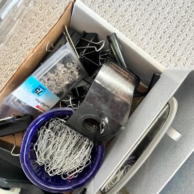 Lot 183 Rubbermaid tote of office supplies and stamps, binder clips, multiple calculators