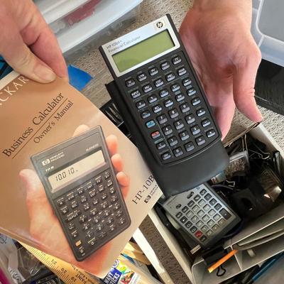 Lot 183 Rubbermaid tote of office supplies and stamps, binder clips, multiple calculators