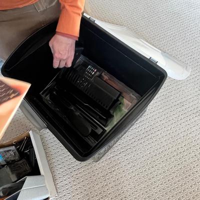 Lot 183 Rubbermaid tote of office supplies and stamps, binder clips, multiple calculators
