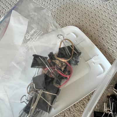 Lot 184 3 plastic storage bins of office supplies - pens, binder clips, command strips