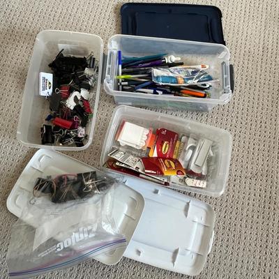 Lot 184 3 plastic storage bins of office supplies - pens, binder clips, command strips