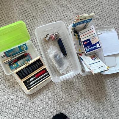 Lot 185 3 plastic bins of labels, glue and sticker labels and numerous exacto knives