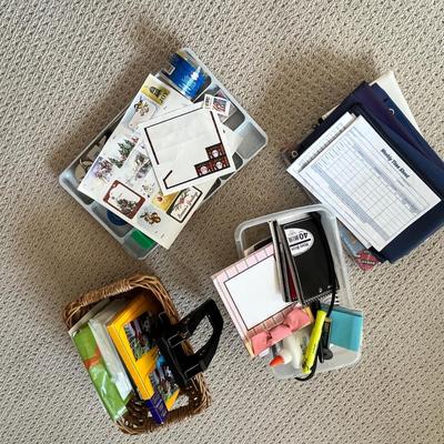 Lot 186 bank bags, plasic box of note pads, basket of photo paper and envelopes, drawer tray with office supplies and postage stamps