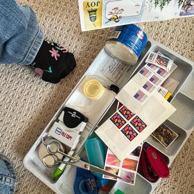 Lot 186 bank bags, plasic box of note pads, basket of photo paper and envelopes, drawer tray with office supplies and postage stamps