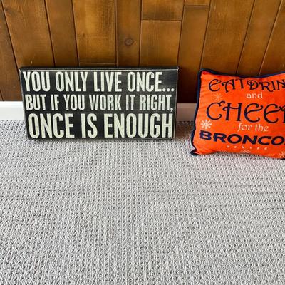 Lot 201 You only live once sign and Broncos pillow