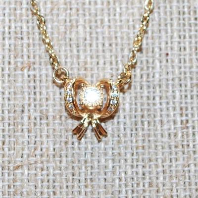 Clear Stones Array Gold Bowtie PENDANT (½" x ½") on a Gold Tone Necklace Chain 16" L