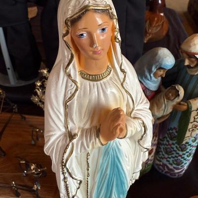 3 religious figures of various sizes