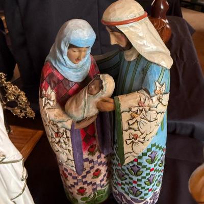 3 religious figures of various sizes