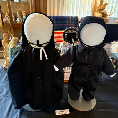 Pair of Faceless black & white dolls on stands
