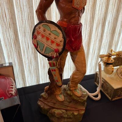 Resin Native American sculpture holding shield 25”t