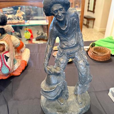 Western Cowboy with saddle sculpture/figure