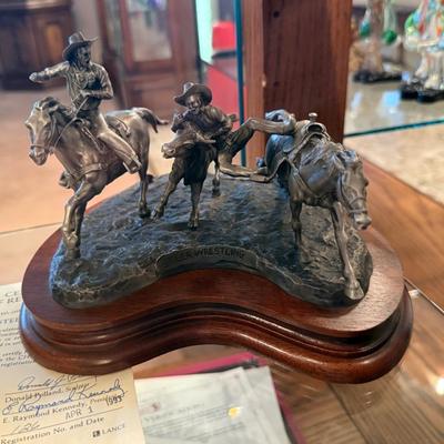 Bronze “Steer Wrestling” by Don Polland on wooden base