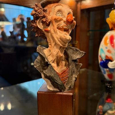 Capodimonte clown on wood base
