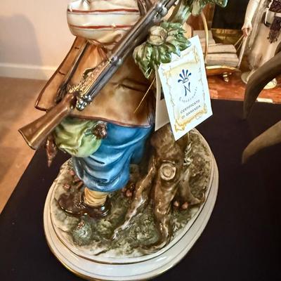 Capodimonte stamped porcelain hunter w/dog & rifle 12”t