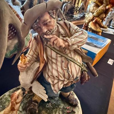 Capodimonte stamped porcelain hunter w/dog & rifle 12”t