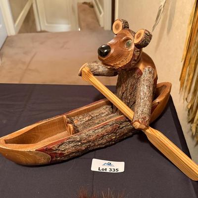 Carved wood Bear in a Canoe decorative piece