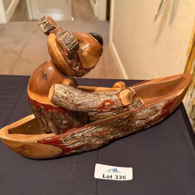 Carved wood Bear in a Canoe decorative piece