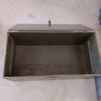 A MILITARY AND METAL TRUNKS
