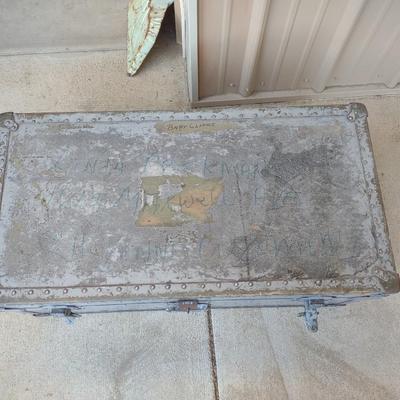 A MILITARY AND METAL TRUNKS
