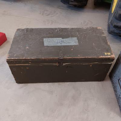 A MILITARY AND METAL TRUNKS
