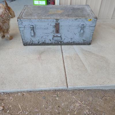 A MILITARY AND METAL TRUNKS