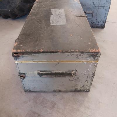 A MILITARY AND METAL TRUNKS