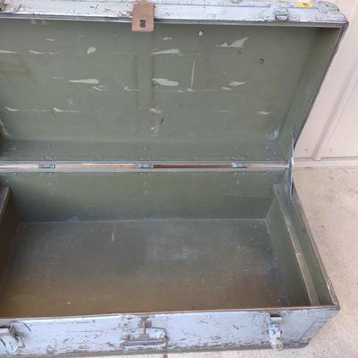 A MILITARY AND METAL TRUNKS