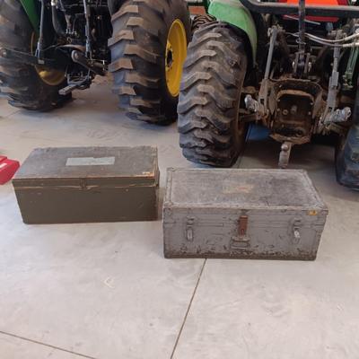 A MILITARY AND METAL TRUNKS
