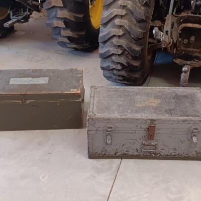 A MILITARY AND METAL TRUNKS
