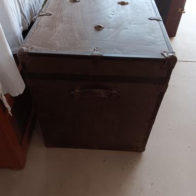 OLD METAL TRUNK WITH A SHELF