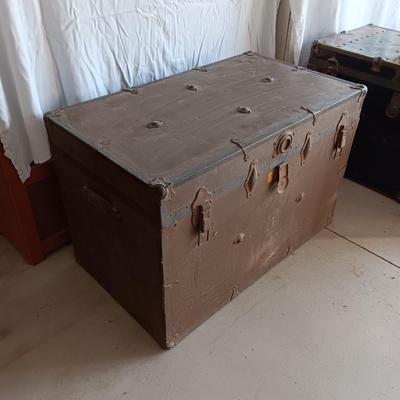 OLD METAL TRUNK WITH A SHELF