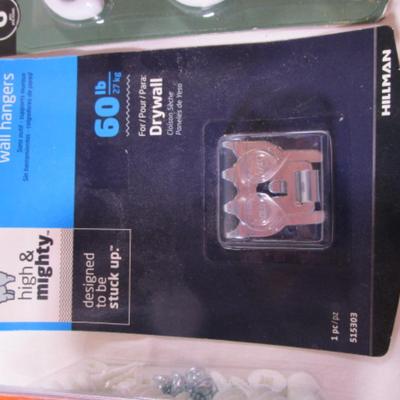 Drywall anchors, pictures hangers, single-prong robe hooks