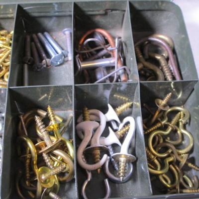 Hardware collection in divided metal case