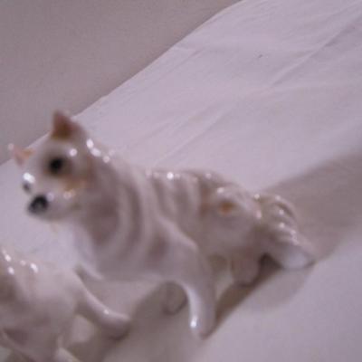 3 porcelain white Husky dogs