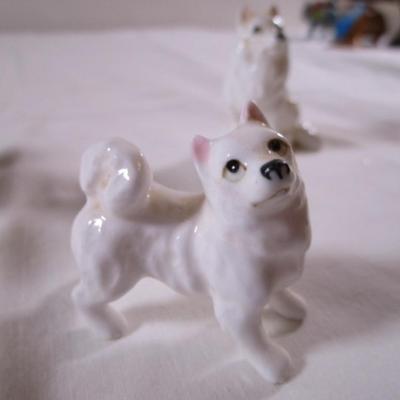 3 porcelain white Husky dogs