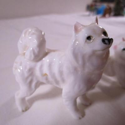 3 porcelain white Husky dogs