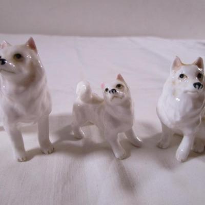 3 porcelain white Husky dogs