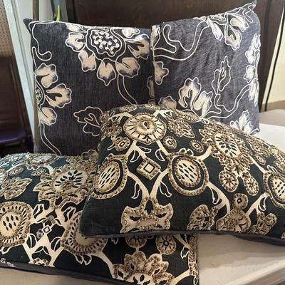 4 NAVY PILLOWS, ONE HAS STAINS ON BOTTOM