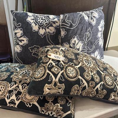 4 NAVY PILLOWS, ONE HAS STAINS ON BOTTOM